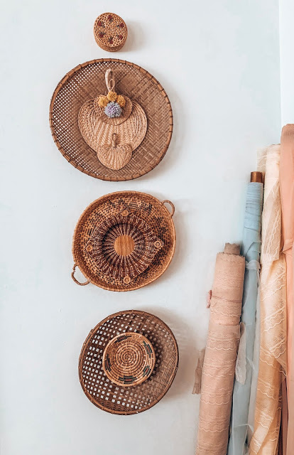 boho basket wall with pastel vintage lace on bolts